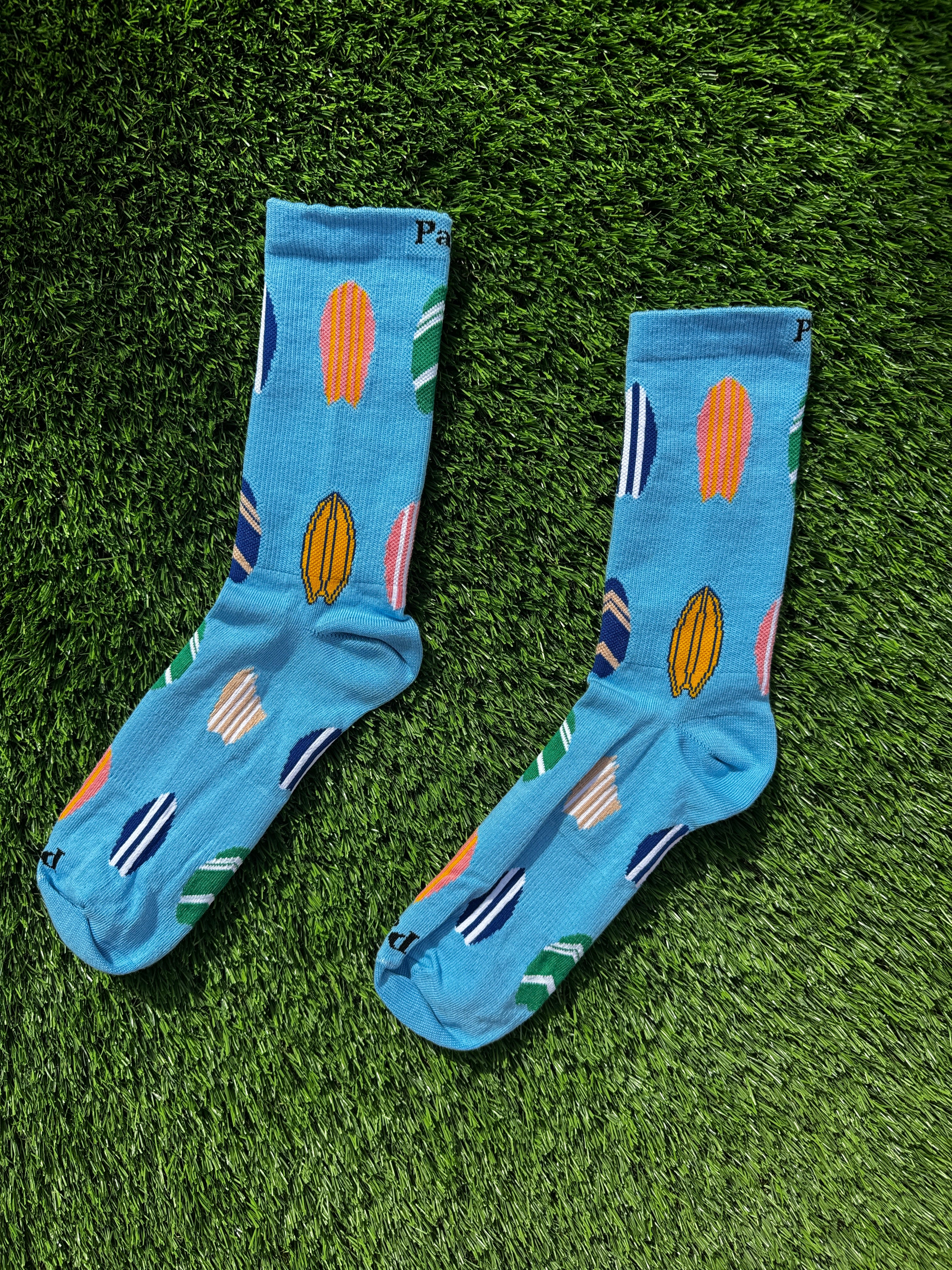 Surfboard crew socks flat lay showing full length design, premium combed cotton