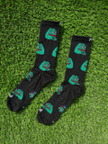 Smug Pepe crew socks with iconic meme character on black background, 100% cotton made in USA