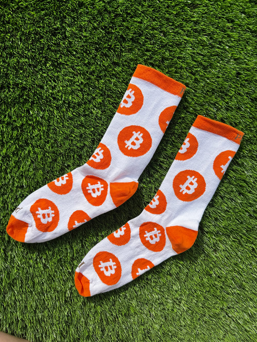 Bitcoin crew socks laid flat on white background, 100% combed cotton made in USA
