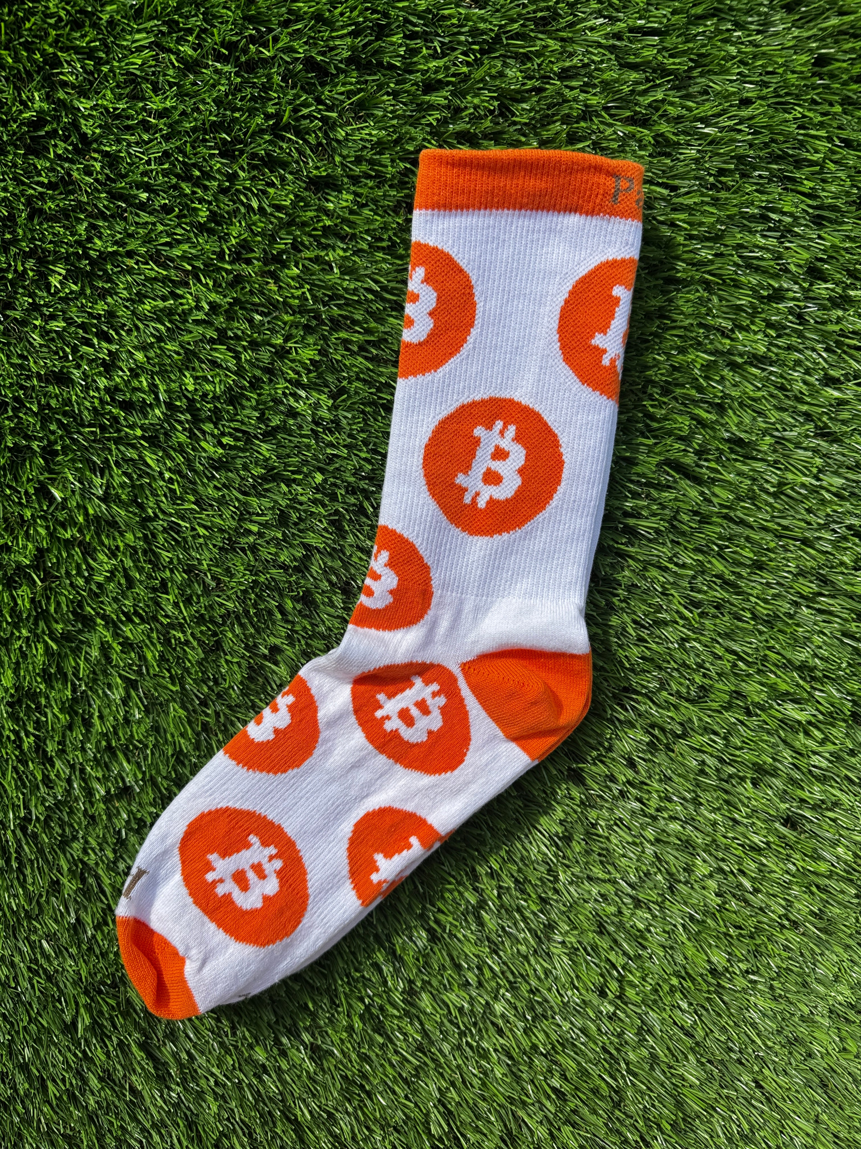 Bitcoin crew socks close-up showing bold Bitcoin logo design, premium cotton
